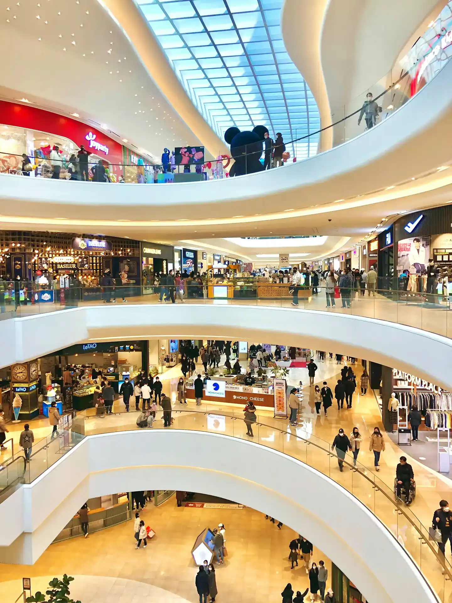 Public area in Dubai with walkways, shops, and modern structures