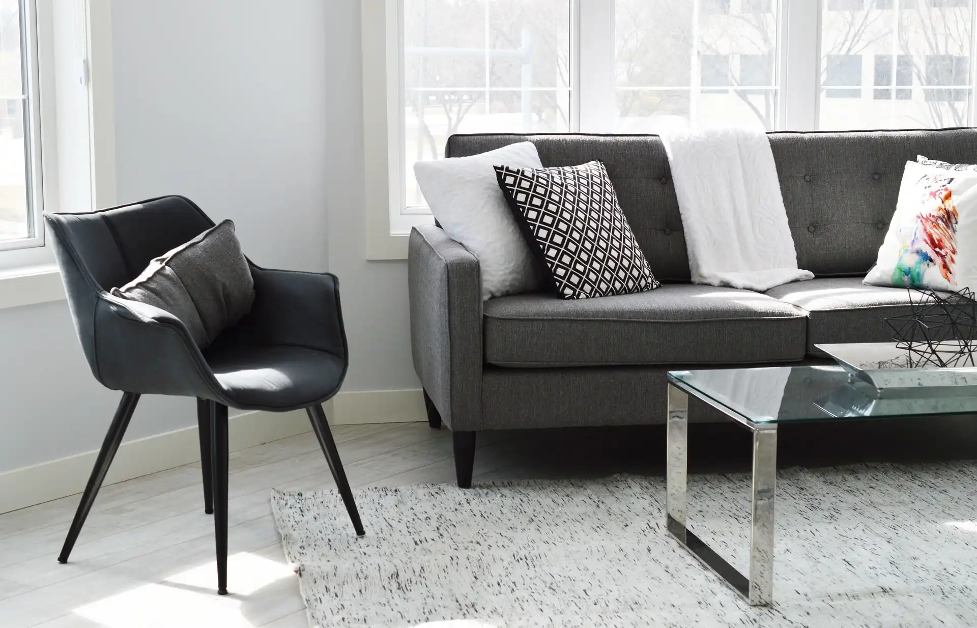 Comfortable living room with sofa, coffee table, and soft lighting