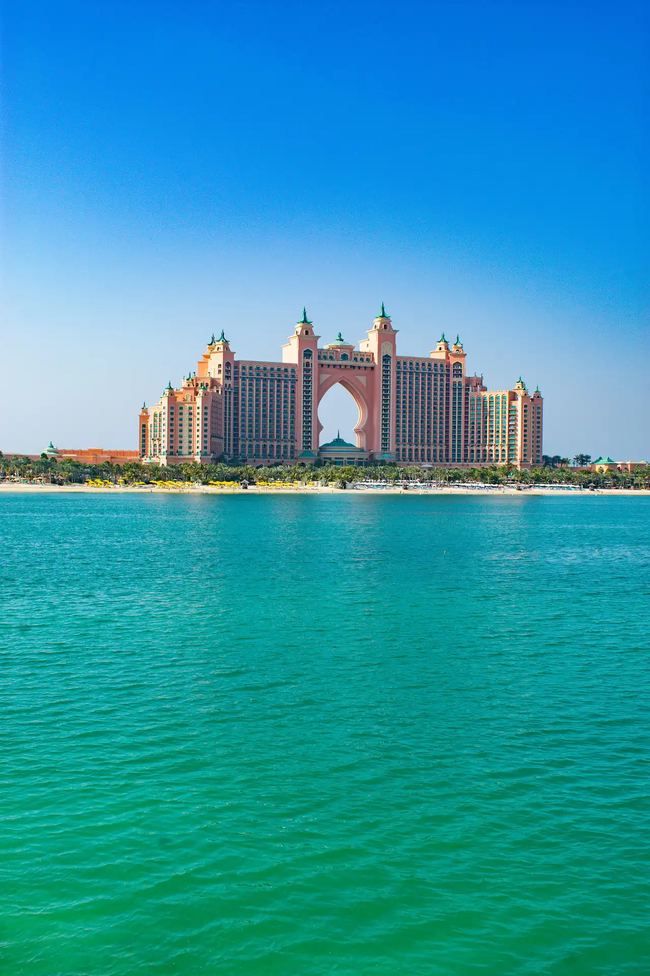 Coastal view in Dubai with shoreline and modern city backdrop