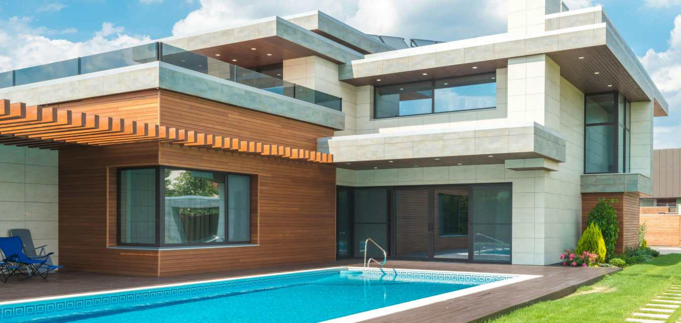 Outdoor pool area with sun loungers and relaxing seating space